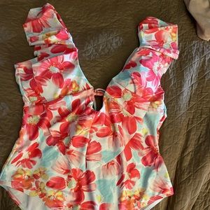 One piece swim suit XL worn 1 time . No stains, tears, no damage multi color